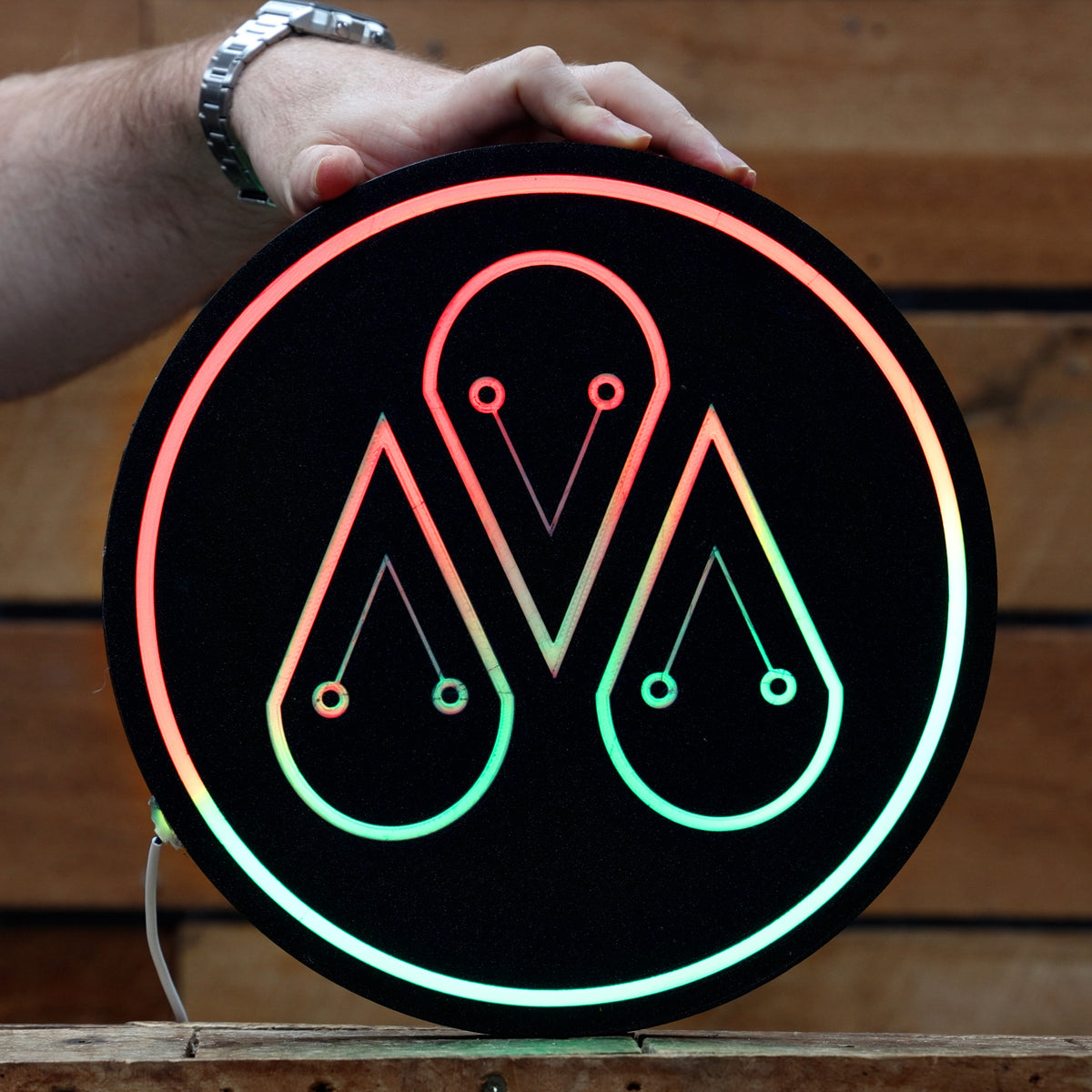 Chase The Craft logo lightbox lit up in the distillery